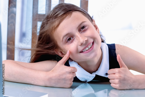 Positive emotions lead to enhanced employee performance and job satisfaction. Young beautiful business girl working with laptop in office. Horizontal image.