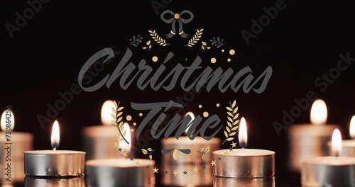 Image of merry christmas time over lit tea candles background