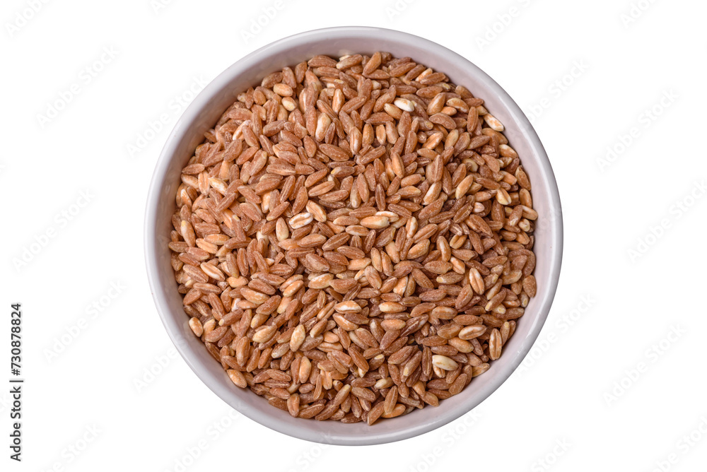 Large grains of wheat porridge are brown in color when raw