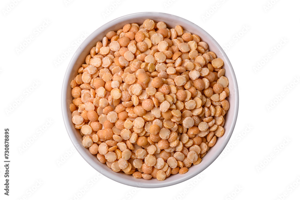 Dried pea grains, divided into halves, are yellow in color when raw Dried pea grains, divided into halves, are yellow in color when raw