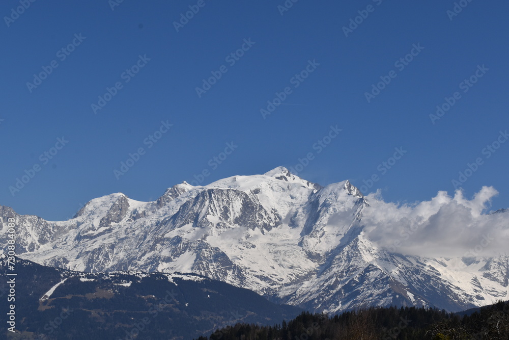 snow covered mountains in winter with blue sky view