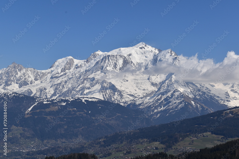 snow covered mountains with blue sky in winter