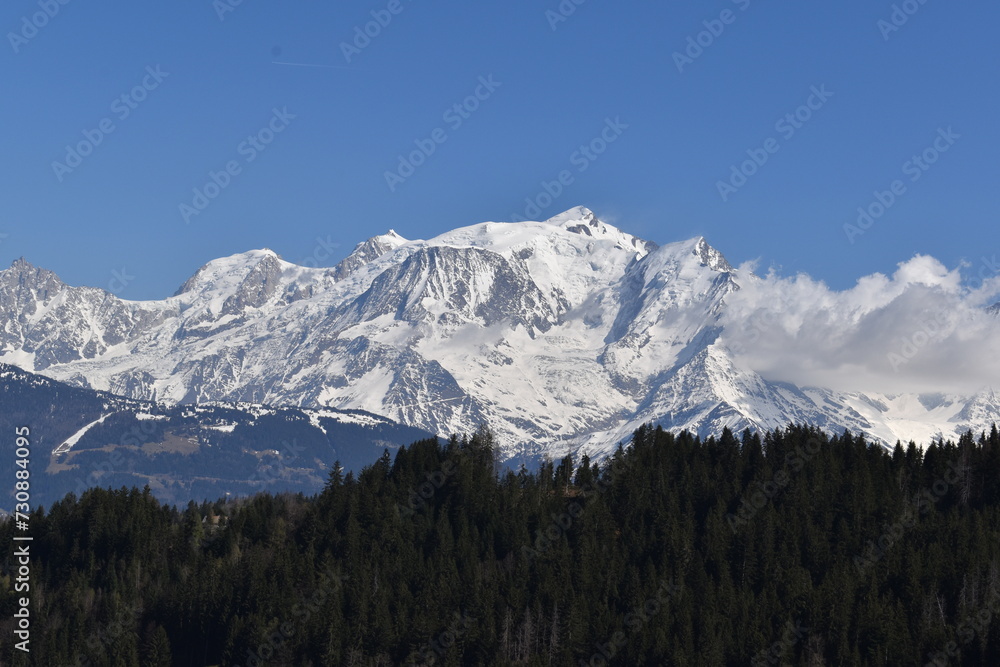 snow covered mountains in winter with blue sky