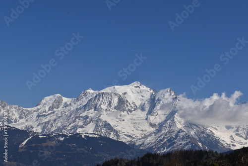 snow covered mountains in winter with blue sky view