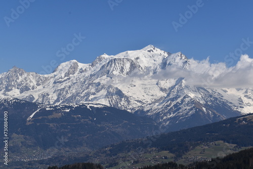 snow covered mountains with blue sky in winter