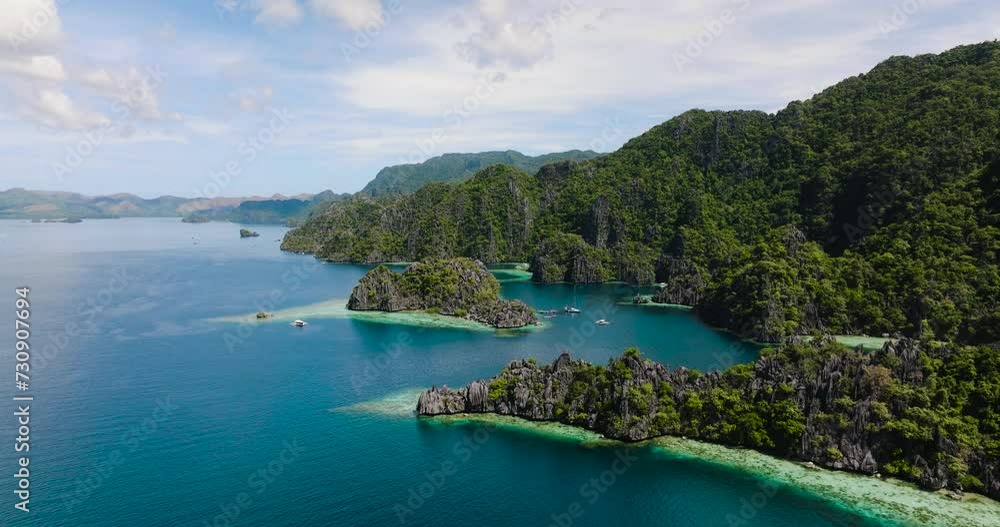 Blue sea and Twin Lagoon surrounded by limestone rocks in Coron, Palawan. Philippines. Blue sea and Twin Lagoon surrounded by limestone rocks in Coron, Palawan. Philippines.