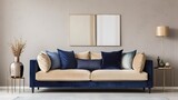 Minimally modern living room with navy blue velour sofa and beige silk pillows. Beige wall painting for art or decor. .