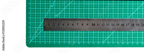 Green cutting mat with a ruler. Cutting concept. do it yourself concept.