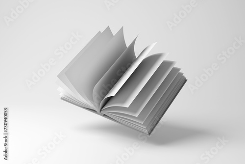Fotografia White book flipping pages and floating in mid air on white background in monochrome and minimalism