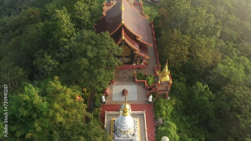 Aerial view of Wat Prathat Doi Prachan and Great Buddha at Doi Phra Chan is a towering bronze Buddha statue that can be reached by climbing 628 steps up, Pa Tan, Mae Tha District, Lampang, Thailand photo