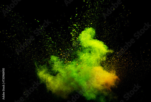 Fototapeta Naklejka Na Ścianę i Meble -  Explosion of green powder dust on a black background