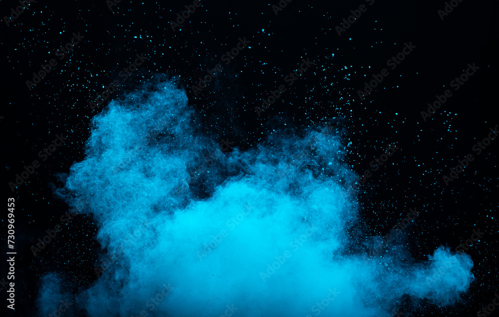 Fototapeta premium Blue powder dust smoke on black background
