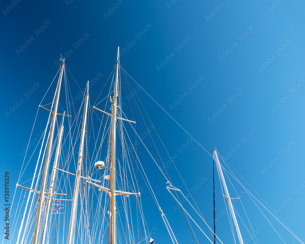 several masts of a yacht without sails several masts of a yacht without sails