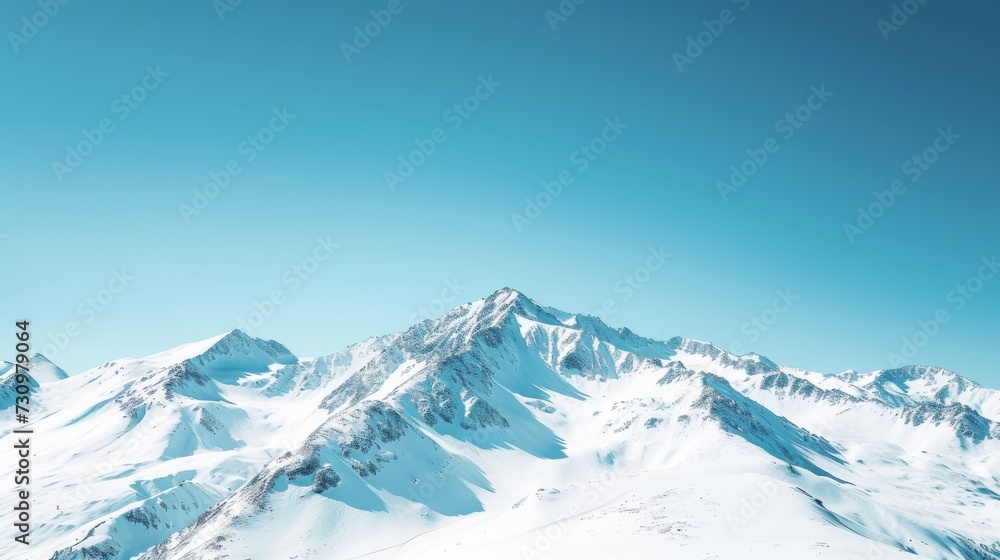 Snow-covered mountain range under a clear blue sky background Snow-covered mountain range under a clear blue sky background