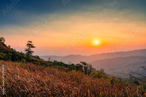 Sunrise over mountain in tropical rainforest at Phu Lom Lo, Phu Hin Rong Kla national park