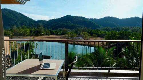 Laptop work remote remote office computer IT, travel with laptop office with lake mountains and palms remotely work education balcony with view Thailand praca zdalna biuro laptop komputer nomad