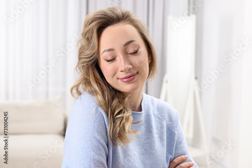 Free Download Portrait of beautiful woman with curly hair at home - GFXLoad