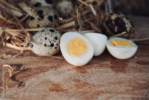 Close up boiled quail eggs on rustic wooden table. 