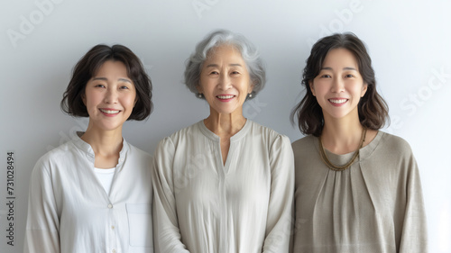 Japanese elderly woman with two adult daughters. Portrait for Mother's Day