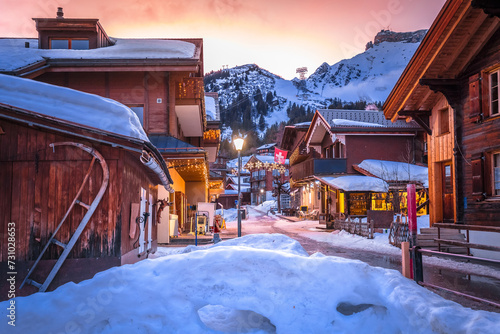 Idyllic Alpine village of Murren street sundown view