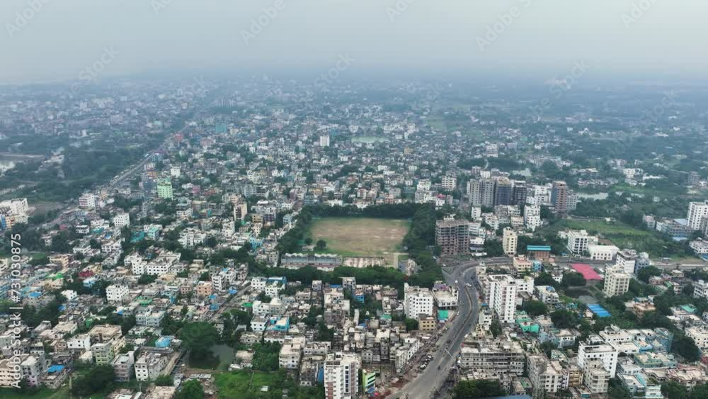 Aerial perspective of Rajshahi city in Bangladesh, nestled by the serene banks of the Padma River. Marvel at its vibrant urban landscape, rich heritage in this captivating drone footage. 4k Aerial perspective of Rajshahi city in Bangladesh, nestled by the serene banks of the Padma River. Marvel at its vibrant urban landscape, rich heritage in this captivating drone footage. 4k