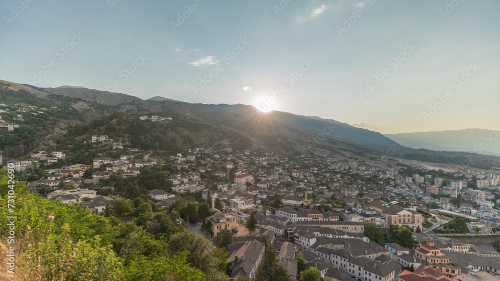 Panorama showing sunset over Gjirokastra city from the viewpoint of the fortress of the Ottoman castle of Gjirokaster timelapse.