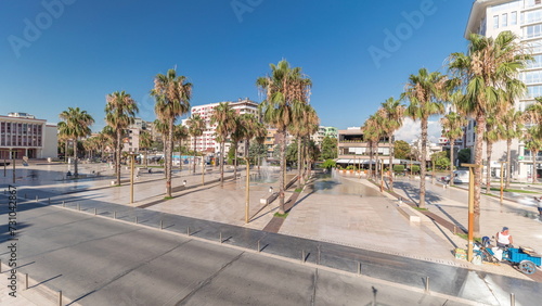 Panorama showing aerial view of the fountains and palms on the main square Sheshi Liria in Durres timelapse  Albania