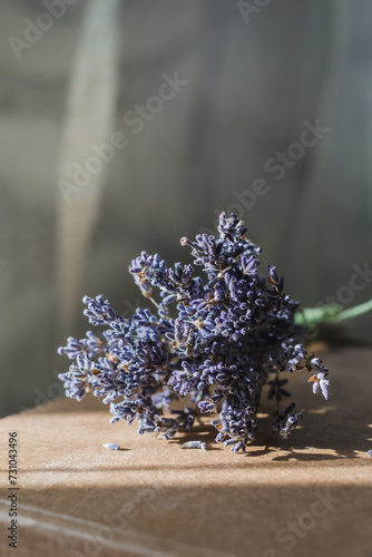 Small bouquet of dried lavender on a cardboard box