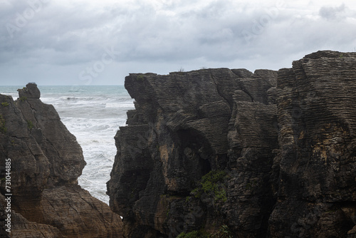 pancake rocks with sea in the background