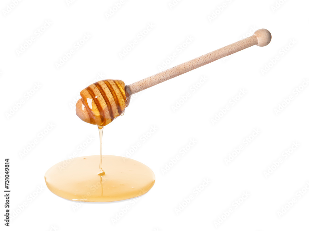 Fresh honey dripping from dipper on white background Fresh honey dripping from dipper on white background