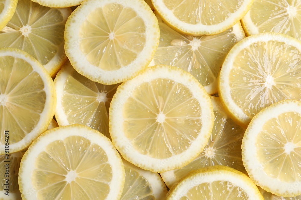 Slices of fresh lemons as background, top view Slices of fresh lemons as background, top view