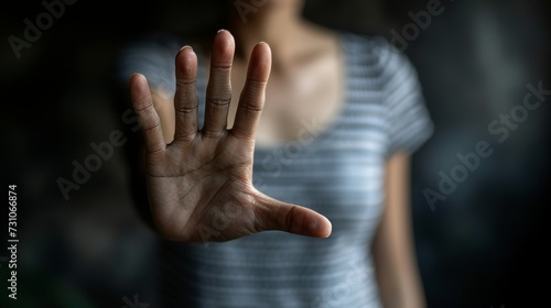 Young woman showing hand gesture, saying no and stop to alcohol, with copy space photo