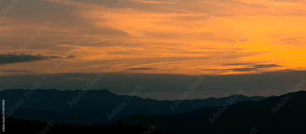Sunset View orange sky and mountains Sunset View orange sky and mountains