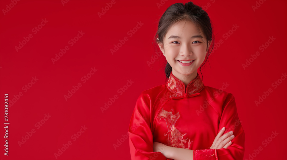 Portrait of smiling Asian girl with Chinese traditional clothing, solid red background. Portrait of smiling Asian girl with Chinese traditional clothing, solid red background.