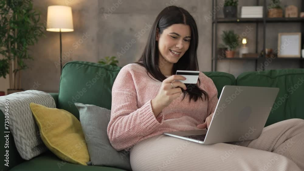 one young adult woman sit at home hold credit card shopping online one young adult woman sit at home hold credit card shopping online