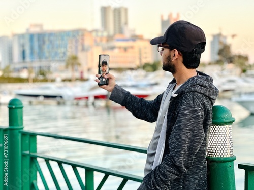  Young teenager in the Kuwait city using mobile technology 