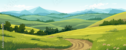 Beautiful summer landscape of a valley with a dirt road through amazing green meadows with trees, fields and hills against a backdrop of stunning mountains and blue skies.