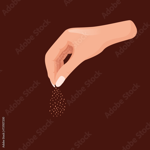 Woman's hand sprinkle a fish food or breadcrumbs