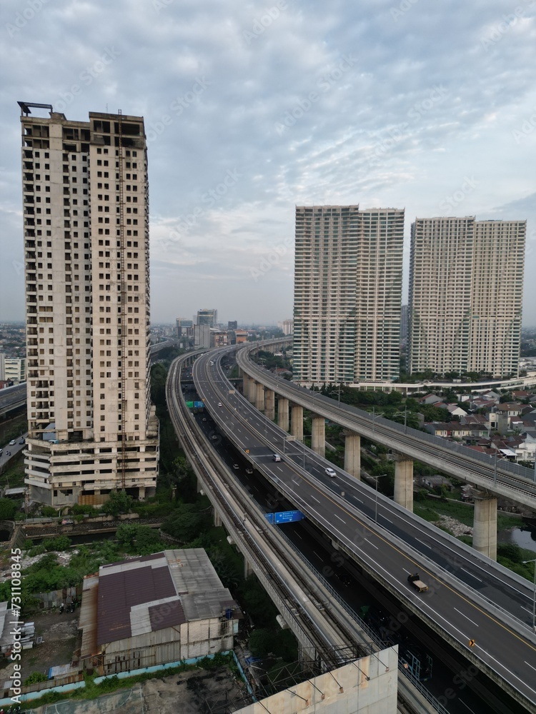 Panoramic cityscape of Indonesia capital city Jakarta at sunset. A rare clear day in the polluted city. Panoramic cityscape of Indonesia capital city Jakarta at sunset. A rare clear day in the polluted city.