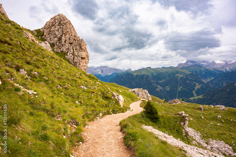 Mountain hiking trail with people walking in Dolomite alps Mountain hiking trail with people walking in Dolomite alps
