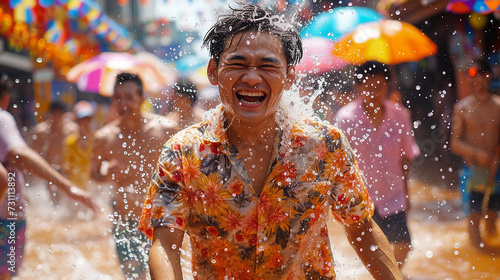 Close up happy Young man having fun on playing water During the Songkran Festival on Khaosan Road  Bangkok  Thailand