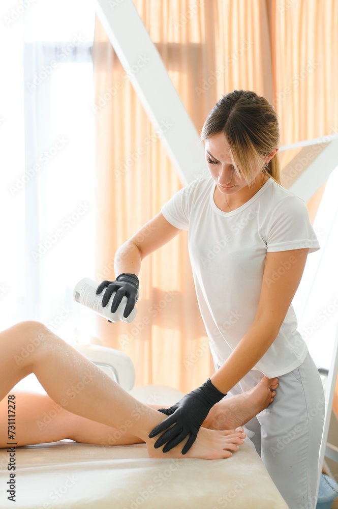 Master of depilation preparation for procedure of hair removal Master of depilation preparation for procedure of hair removal