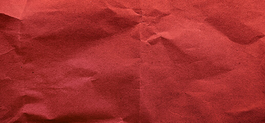grunge old red paper texture use as background with blank space for design. kraft red wrinkle recycle paper background. rough paper texture for party, scarpbook concept.