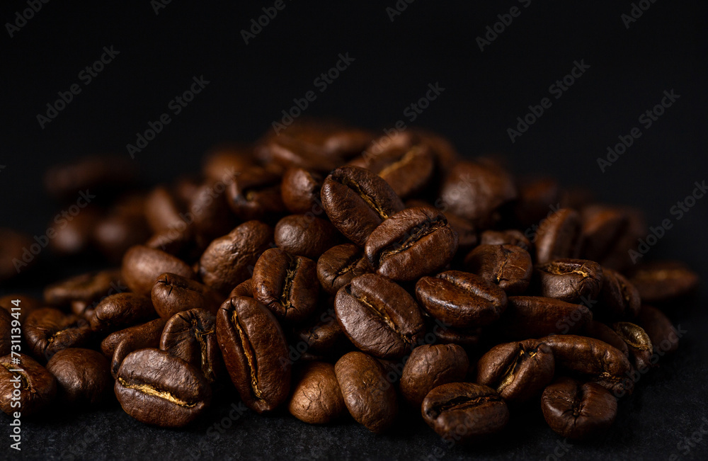 Naklejka premium Coffee beans close up. A fragrant drink for a cheerful day