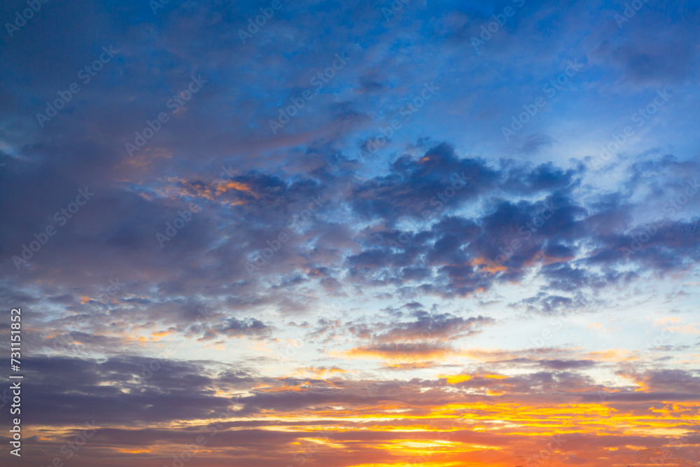 Beautiful Vivid sky painted by the sun leaving bright golden shades.Dense clouds in twilight sky in winter evening.Image of cloud sky on evening time.Evening Vivid sky with clouds Beautiful Vivid sky painted by the sun leaving bright golden shades.Dense clouds in twilight sky in winter evening.Image of cloud sky on evening time.Evening Vivid sky with clouds