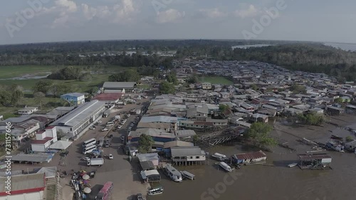 The city of Careiro da Varzea lies on the banks of the Solimões River, near the capital Manaus, in the Brazilian Amazon. Aerial view on a sunny day with late evening light.