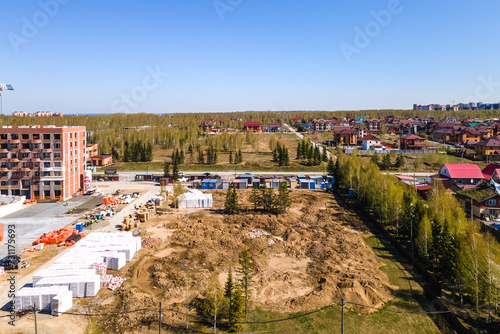 Photography the construction site of an apartment building in the summer from a height