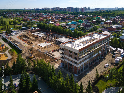 Photography the construction site of an apartment building in the summer from a height