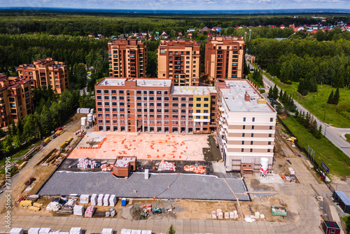 Photography the construction site of an apartment building in the summer from a height