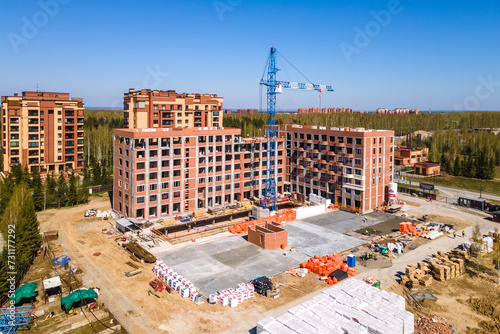 Photography the construction site of an apartment building in the summer from a height